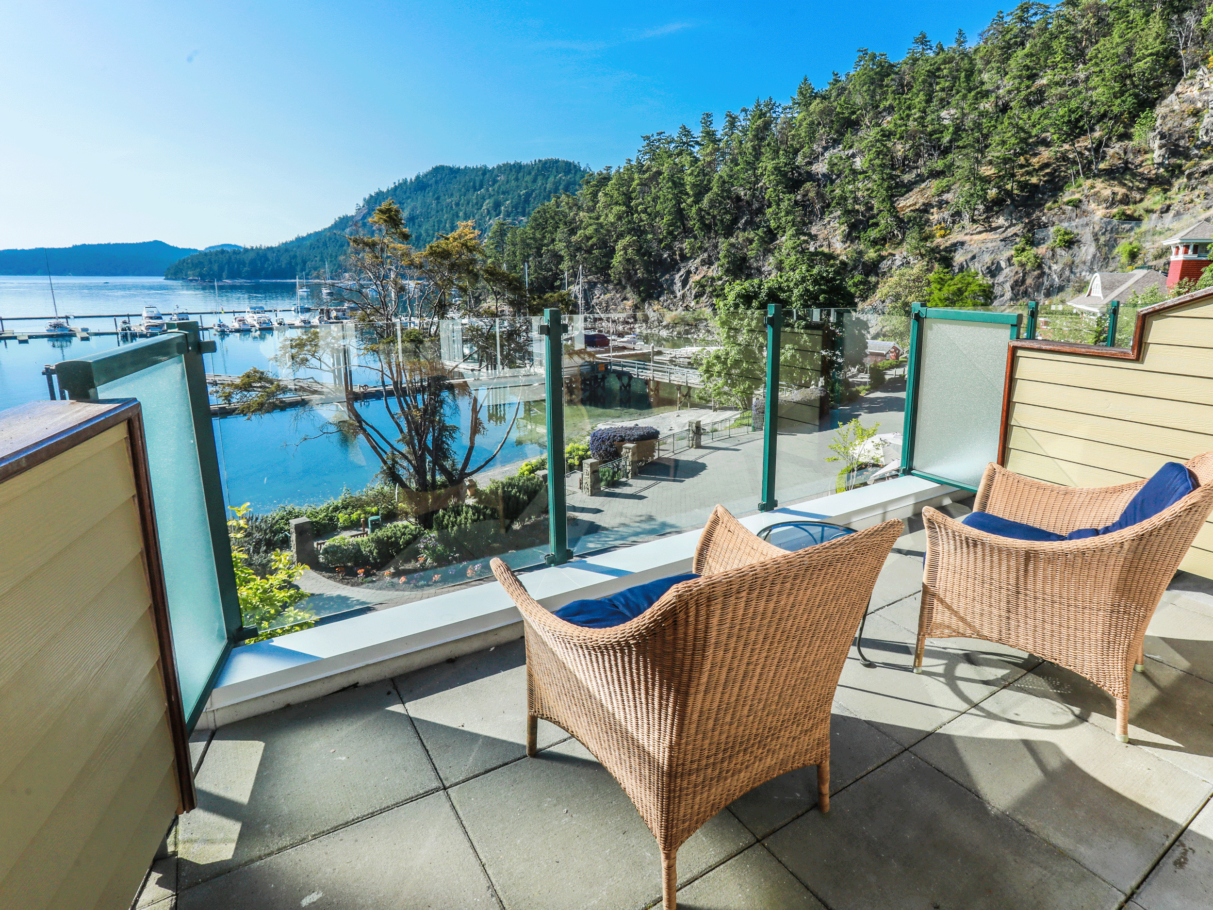 two chairs on balcony overlooking cove