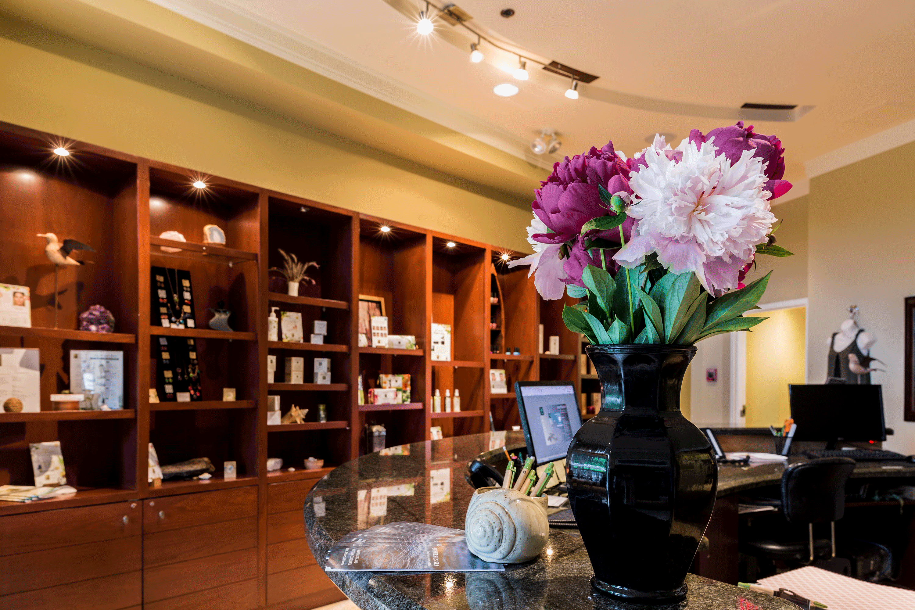 lobby desk with pink flowers