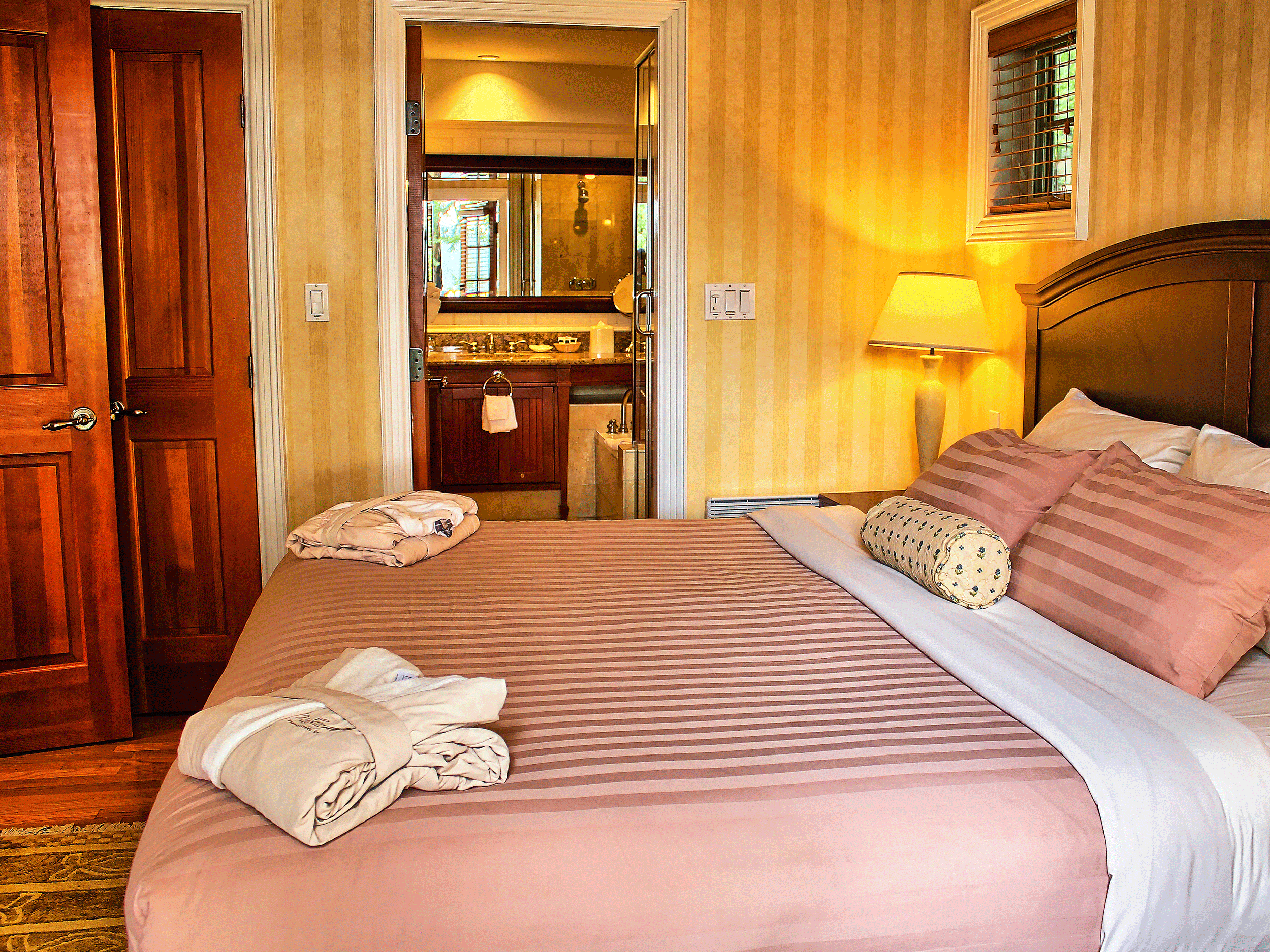 pink bed in yellow room