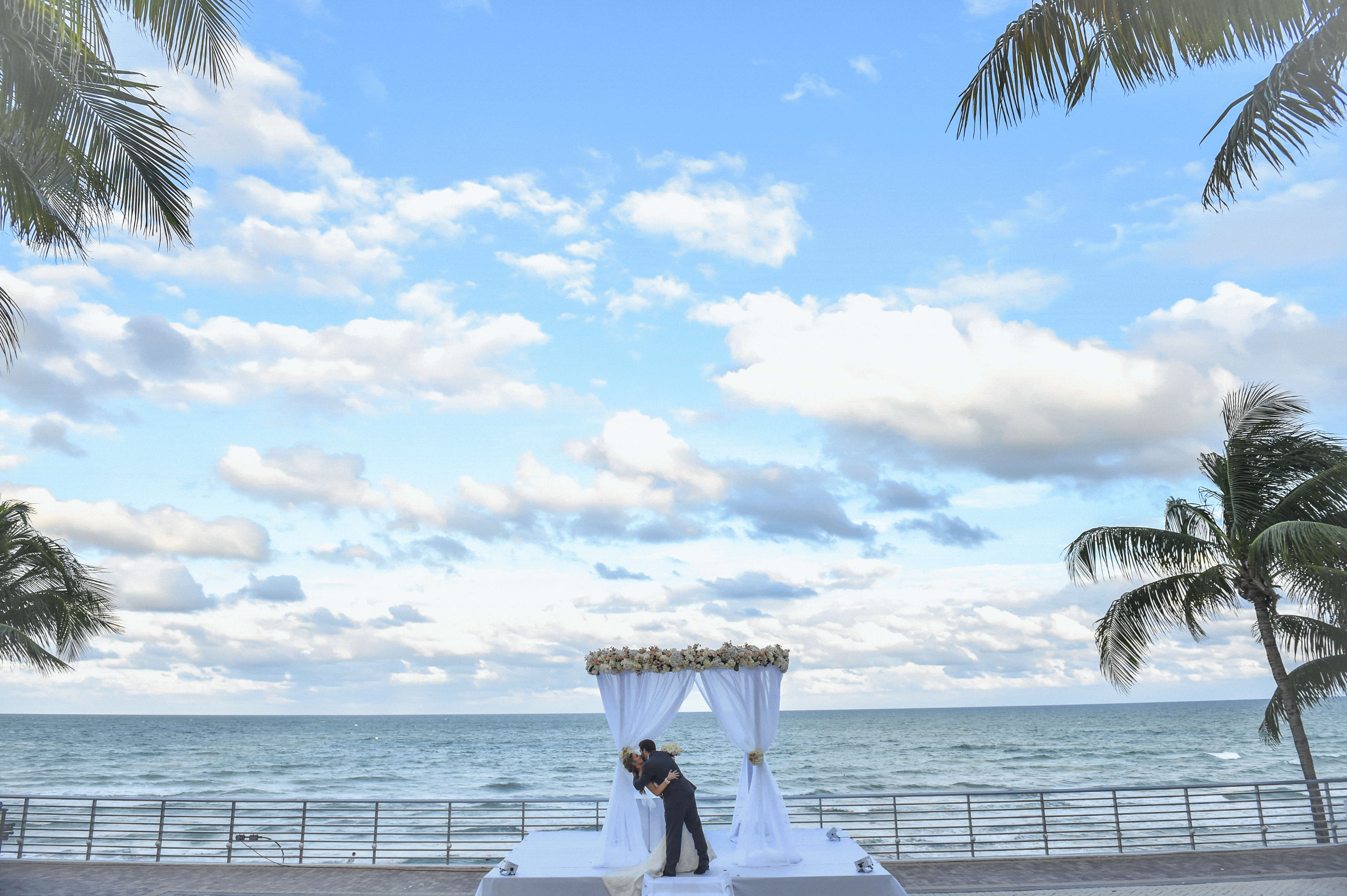 Bride & Groom on their wedding near the beach at Diplomat Beach