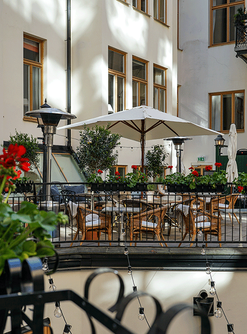 An outdoor dining and lounge area at The Sparrow Hotel