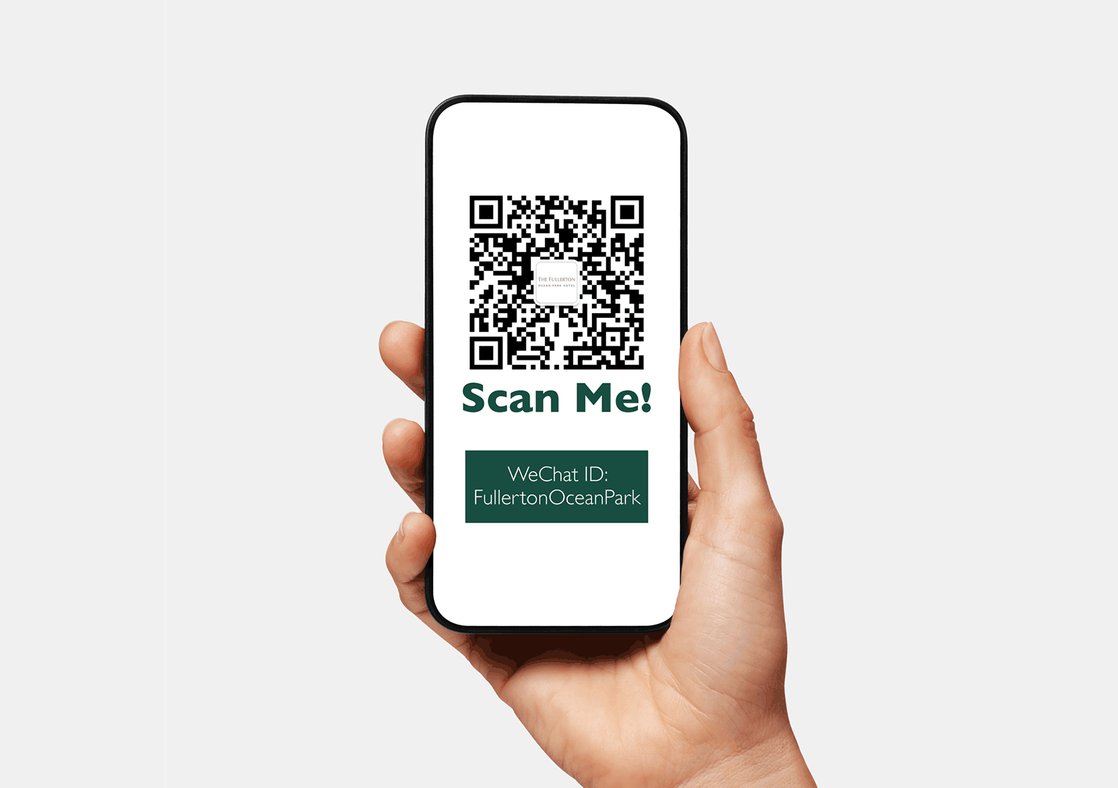 Hand holding a phone displaying the official WeChat QR code for Fullerton Ocean Park Hotel Hong Kong
