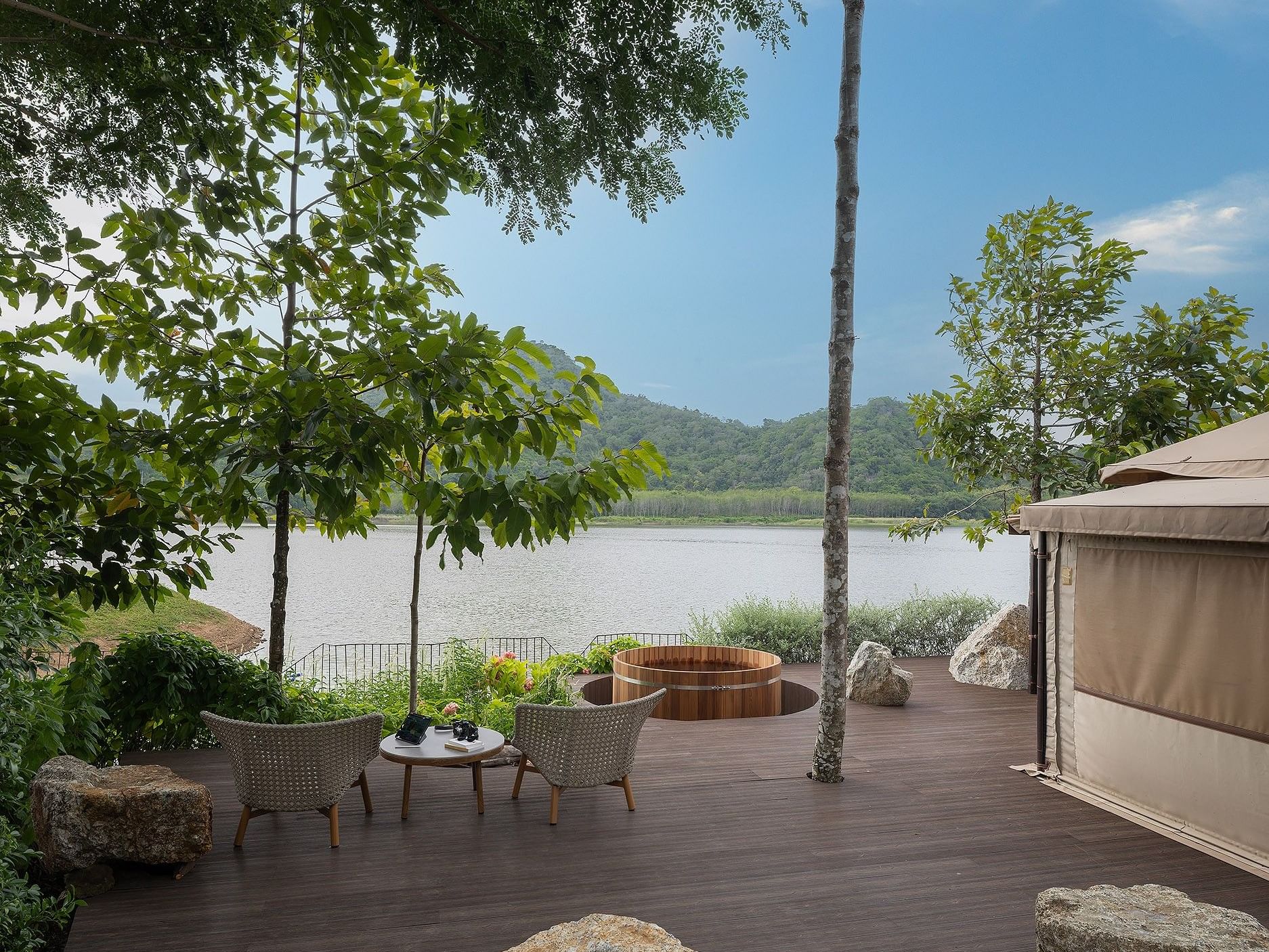 Wall-mounted TV over desk & hanging bathrobes in Lakefront Glamping Terrace Villa with Wooden Tub at U Khao Chi Chan