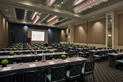 a large ballroom with chairs and tables