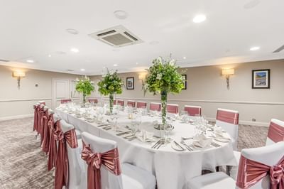Albyn Suite private dining room at The Aberdeen Altens Hotel with a long table set for a celebration