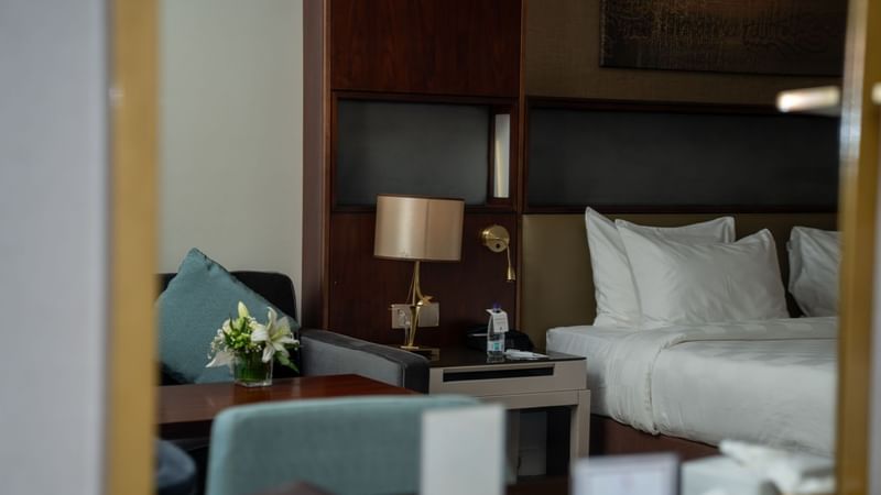 Cozy Executive King Room with desk and chair at Saja by Warwick Madinah.