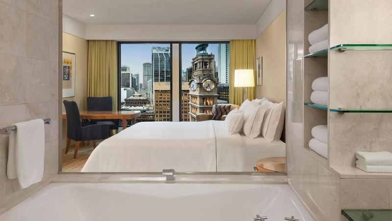 Interior of a room with a king bed at Fullerton Sydney