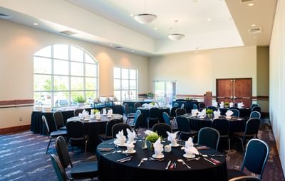Dundarave, featuring round dining tables and black chairs under soft lights at Rodd Brudenell River Resort