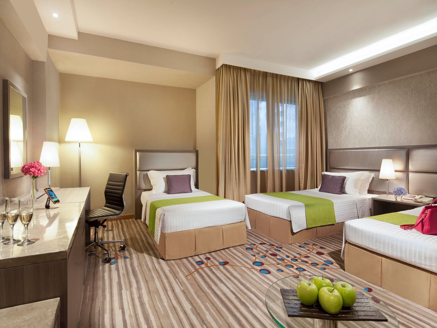 Interior of Deluxe Triple Room with carpeted floors at Park Hotel Hong Kong