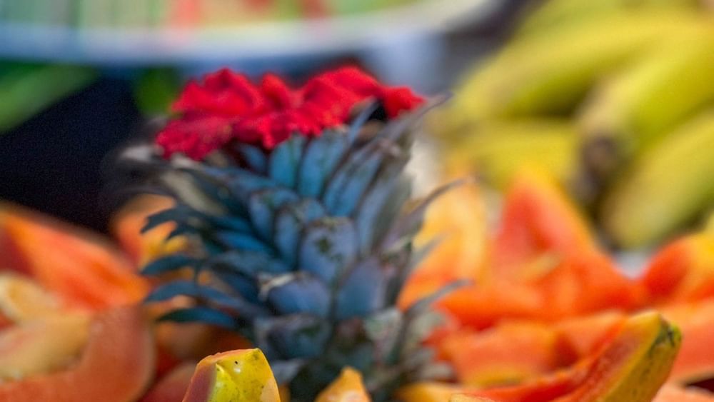 Fruit platter with pineapple and papaya slices at Nukunuku Restaurant & Bar in Korolevu at The Naviti Resort Fiji.