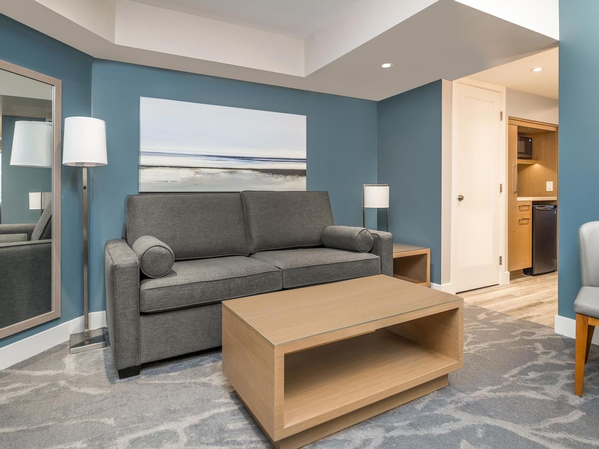 Couch and coffee table in our Coast King Suite room