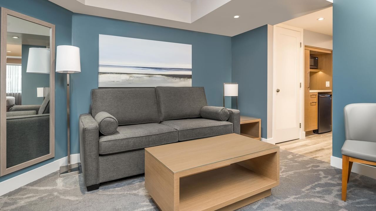 Couch and coffee table in our Coast King Suite room