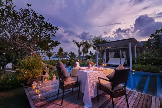 Romantic dining on a deck by the pool at Danna Langkawi