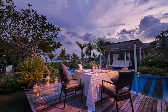 Romantic dining on a deck by the pool at The Danna Langkawi