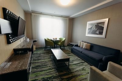 Lounge area in a Suite with TV & wall painting, Araiza San Luis