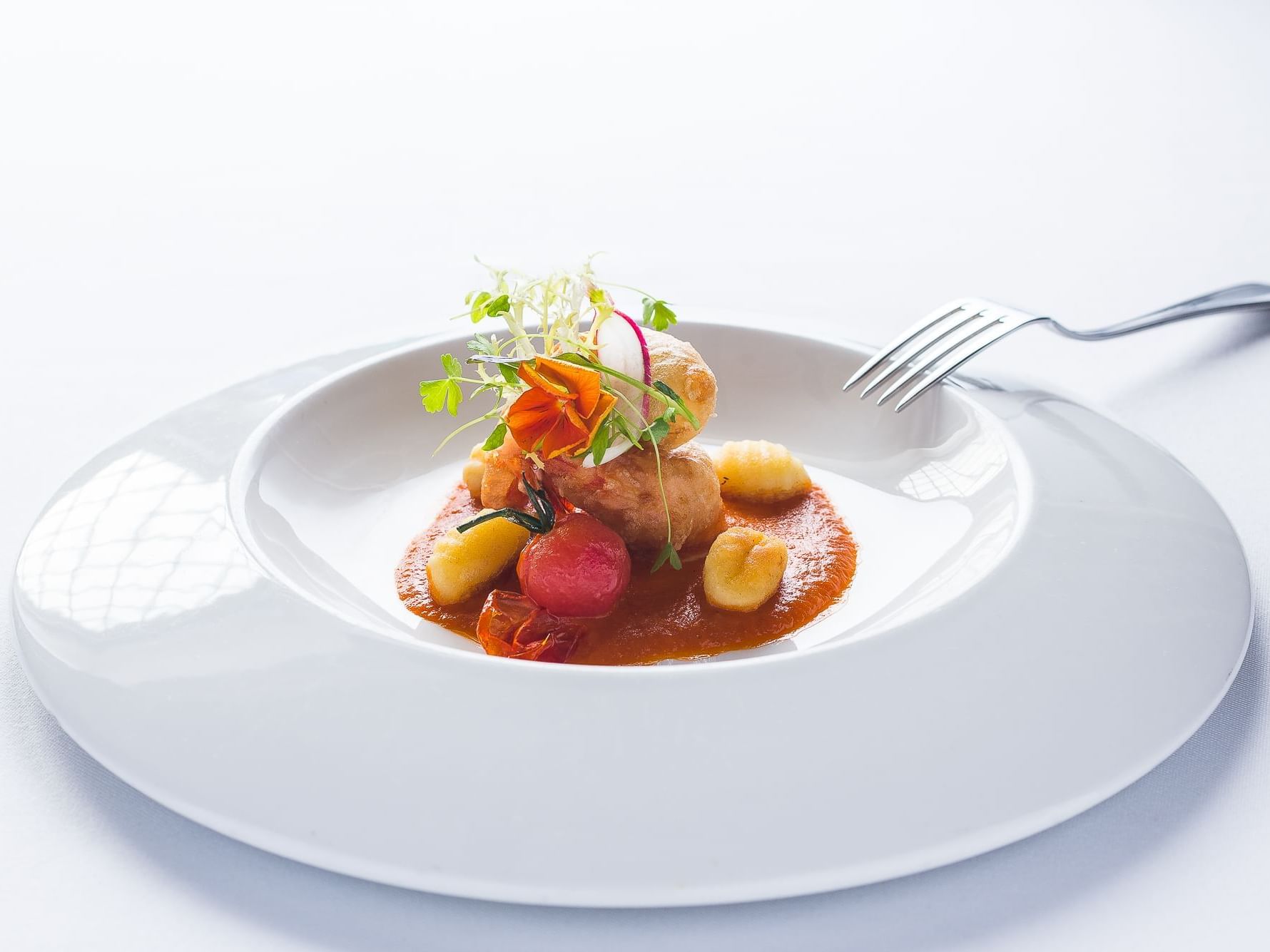 Expertly plated Tempura Prawns with Tomato Fondue and Cherry Tomatoes, served at Tudors Restaurant, Marygreen Manor