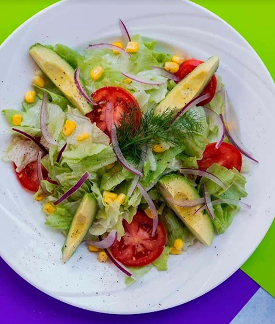 Close-up of a salad bowl with avocado at Regis Hotel & Spa