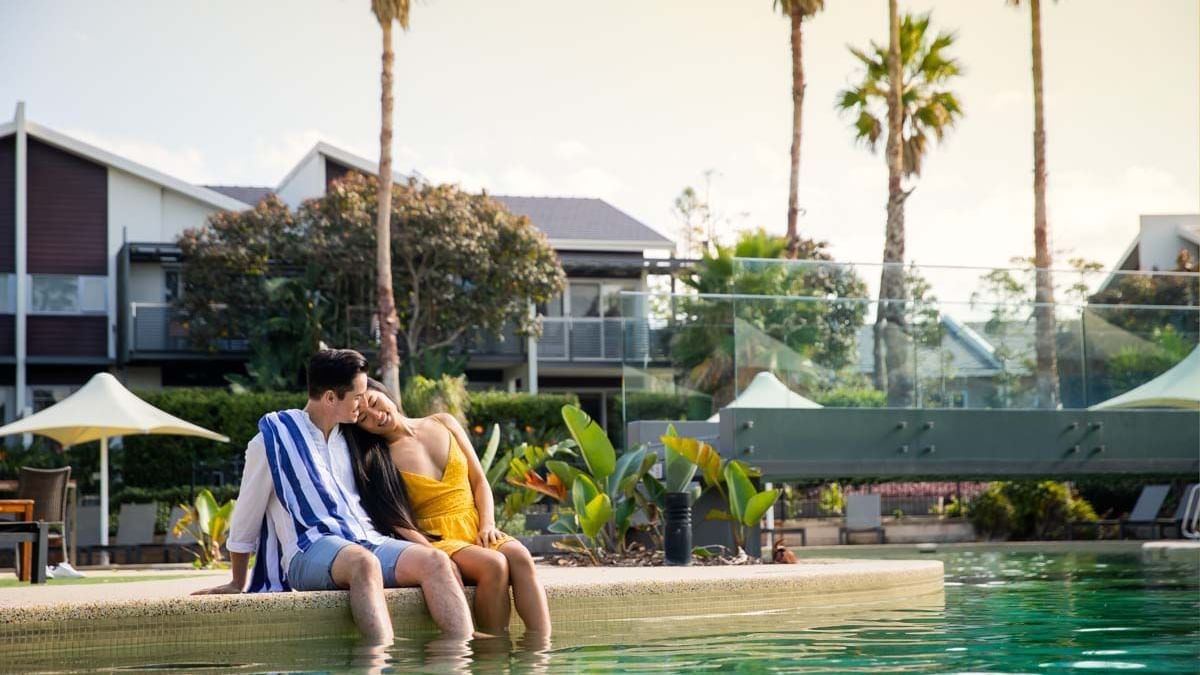 Couple at Lagoon Pool Pullman Magenta Shores Resort