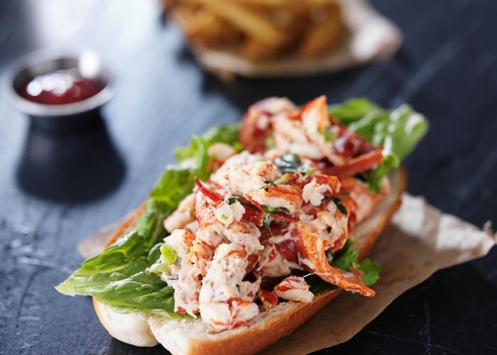 Close-up of a lobster sandwich served at Ogunquit Collection