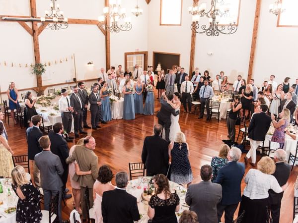 Newlyweds dancing at wedding reception.