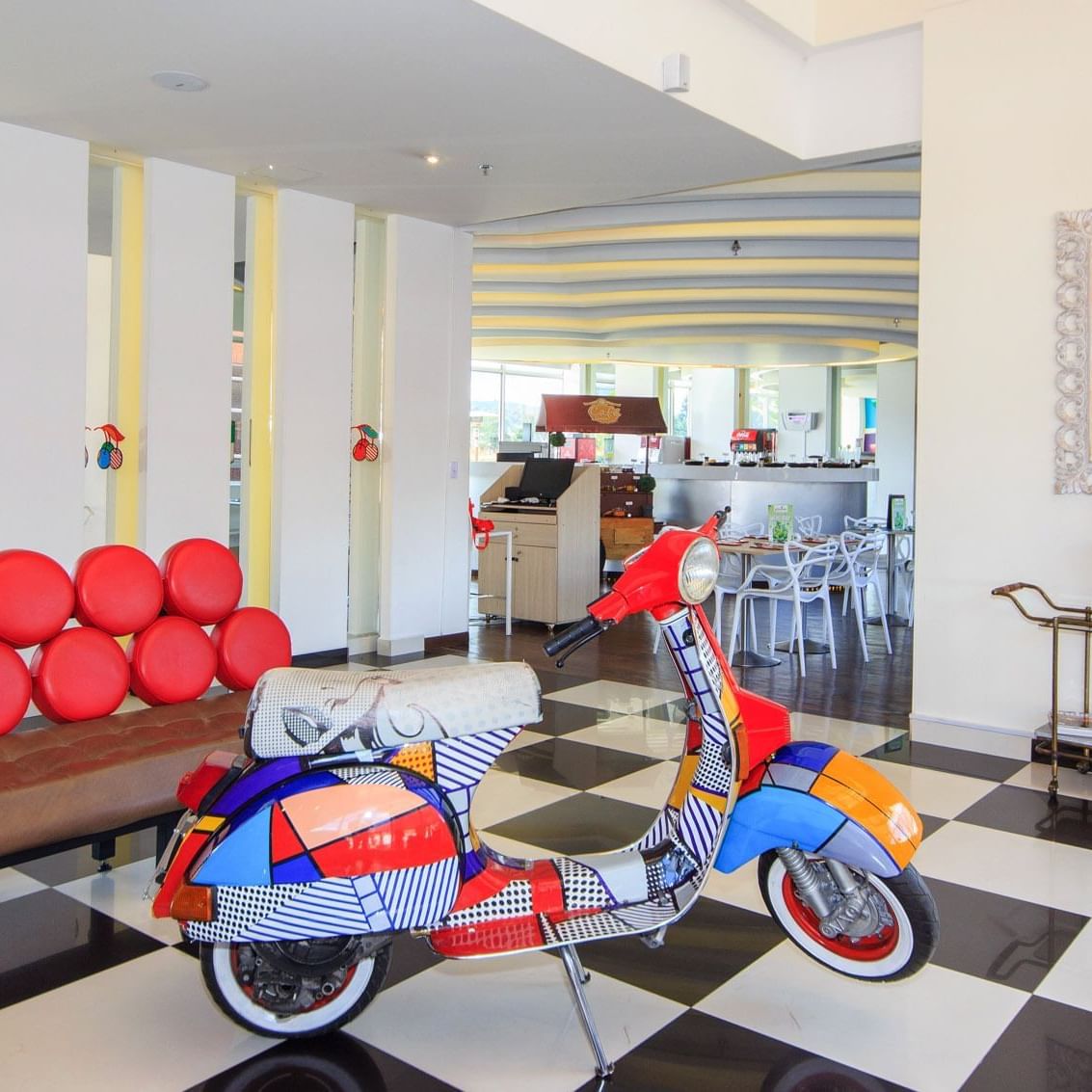 Lobby area with a parked Motor bike décor at POP Art Tocancipa