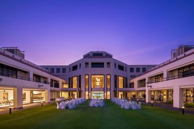 Outdoor arrangement of banquet tables under the evening sky at Eastin Thana City Golf Resort Bangkok