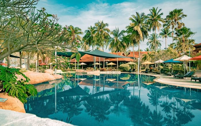 Outdoor swimming pool area at Pelangi Beach Resort & Spa