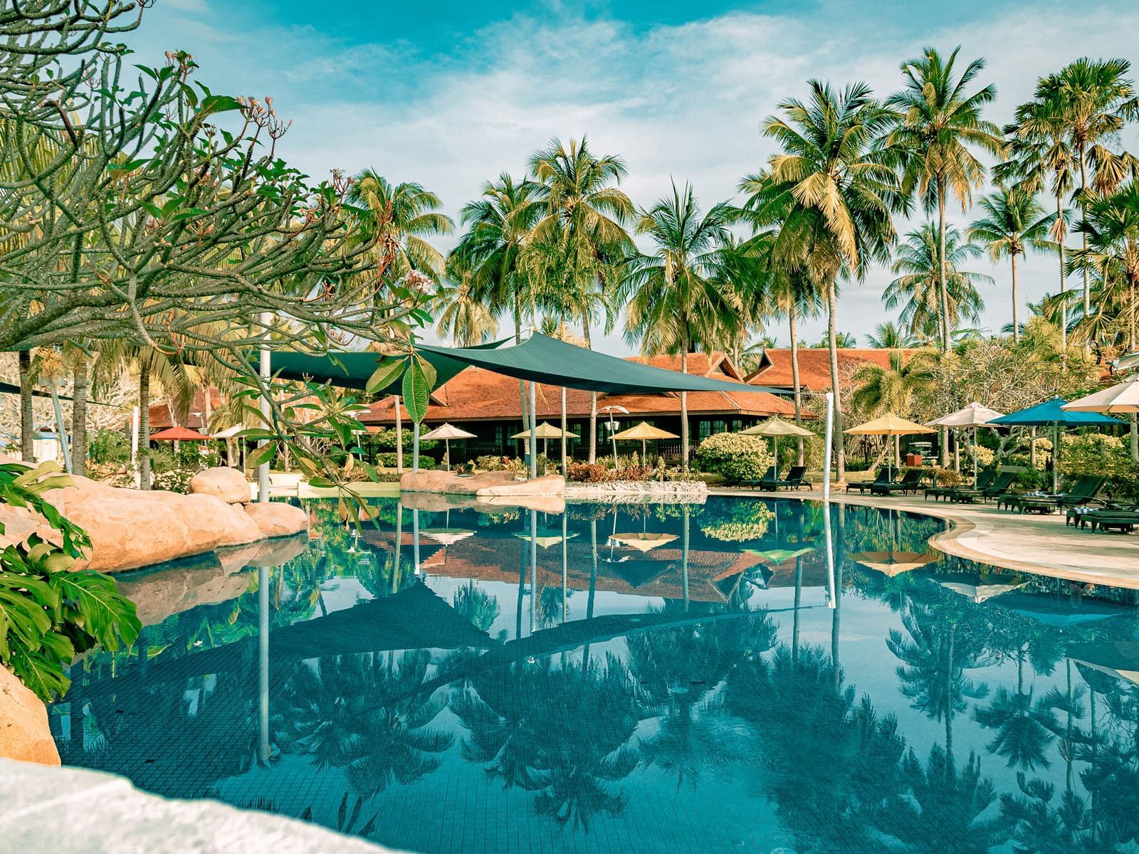 Outdoor swimming pool area at Pelangi Beach Resort & Spa