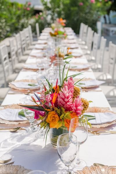 Close-up of a tropical floral centerpiece on a table at Barefoot Cay Resort & Marina