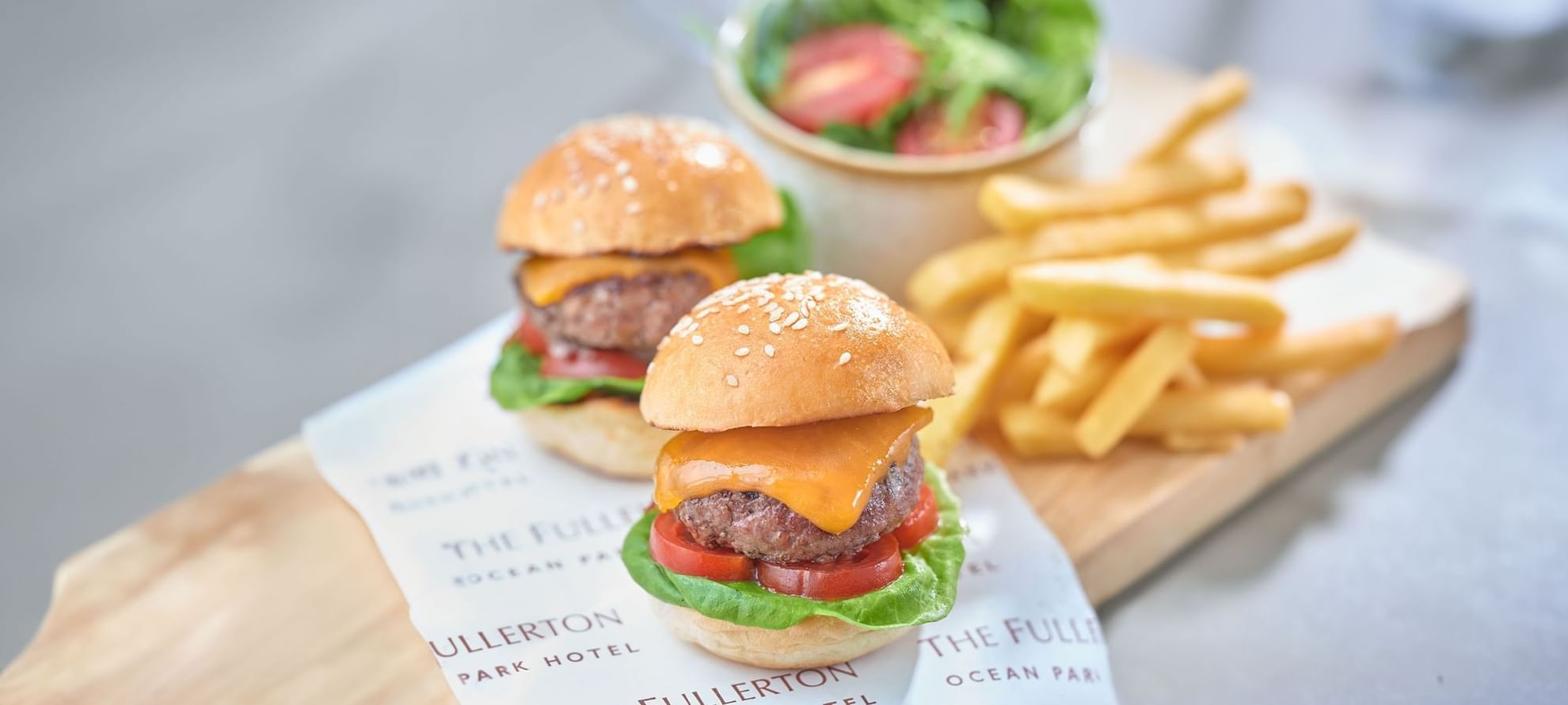 Burgers and fries served on a charcuterie board at Fullerton Ocean Park Hotel Hong Kong