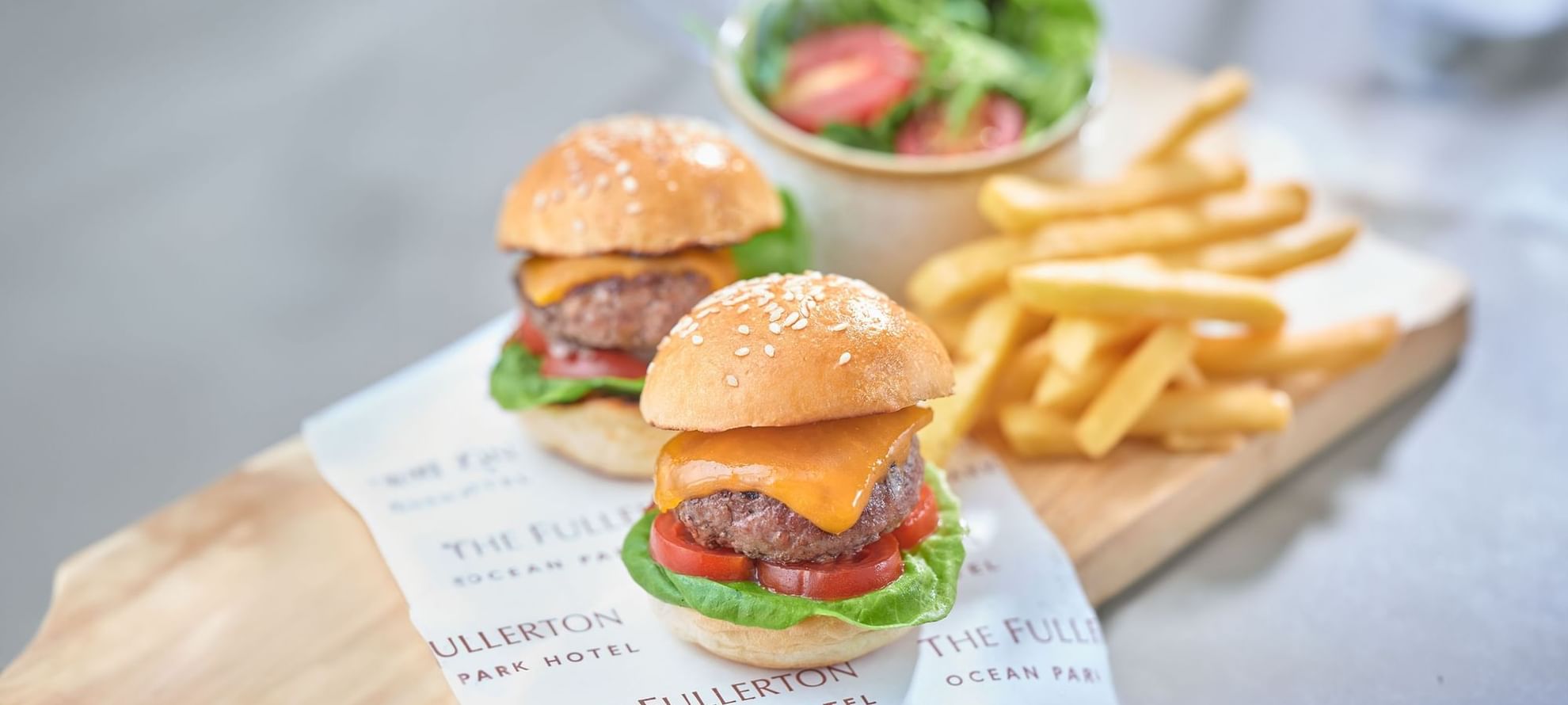 Burgers and fries served on a charcuterie board at Fullerton Ocean Park