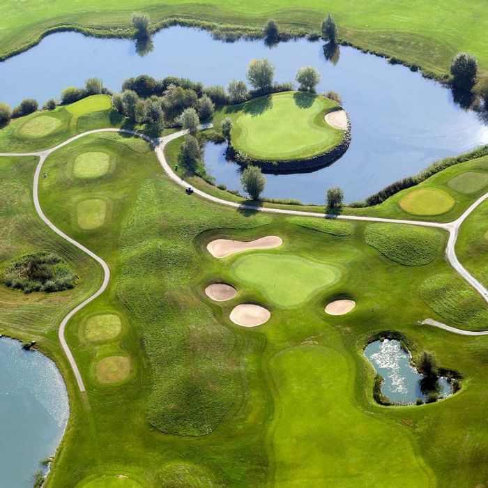 Aerial view of a golf court, Falkensteiner Hotels & Residences