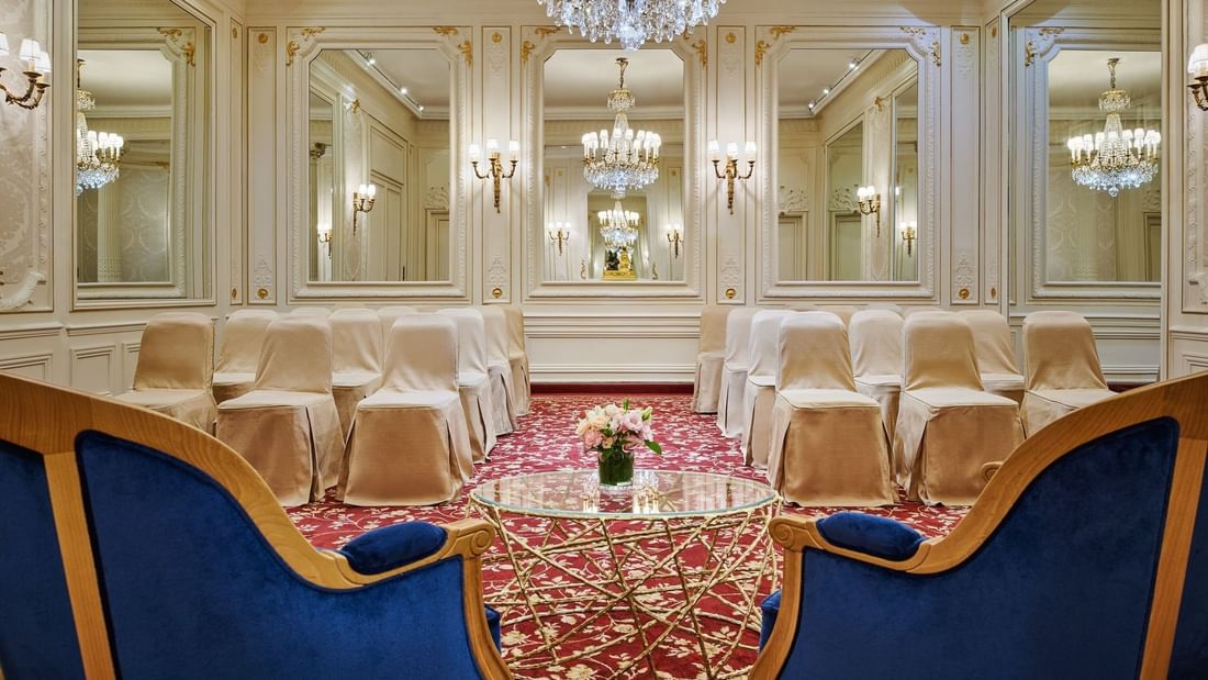 Armchair with a glass coffee table facing the theater set up in Capucines Meeting Room at Hotel Westminster Paris
