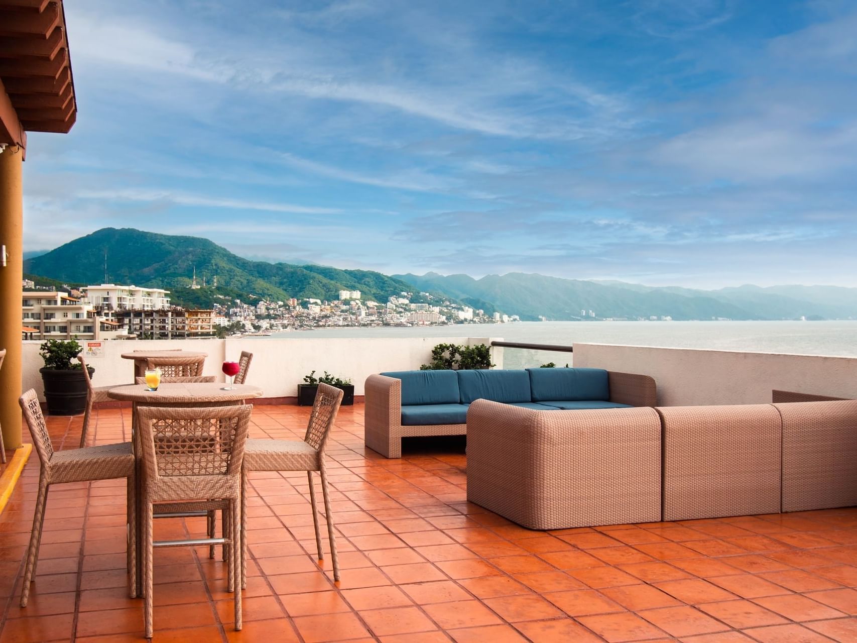 Rooftop dining area of Sky Bar Lounge at Plaza Pelicanos Grand Beach Resort