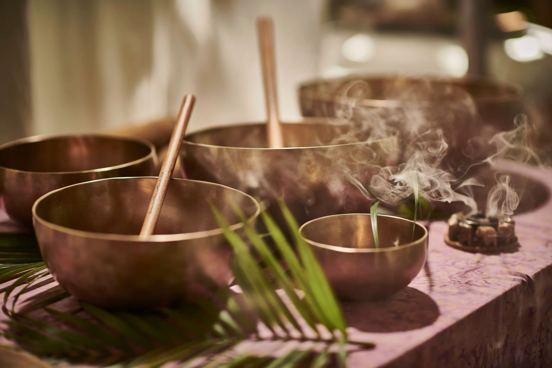 Closeup of meditation bowls at Cala Luna Boutique Hotel