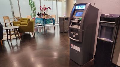 ATMs, tables & sofas in the lobby area at Stay Hotel Waikiki