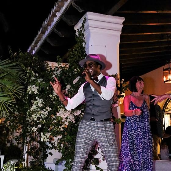 Closeup of a singer performing at a party in Marbella Club