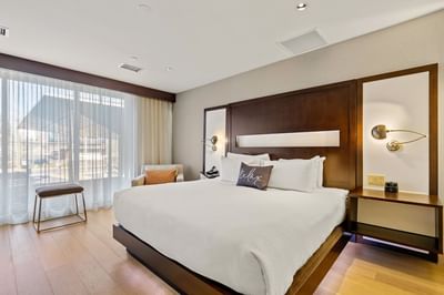 Bed near window in King Accessible Suite at The J House Greenwich, a modern boutique hotel in Greenwich Connecticut