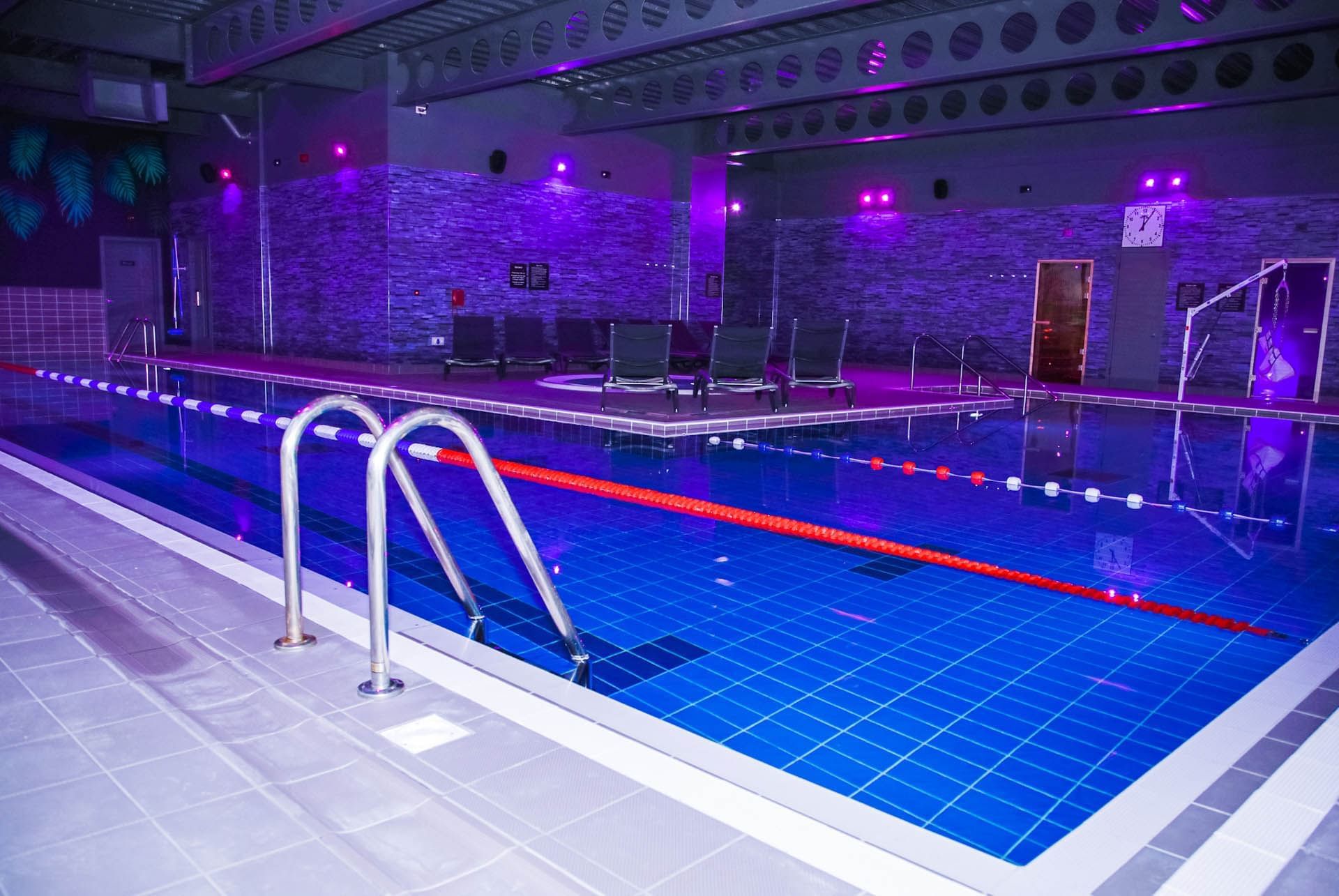 Indoor pool with decorative led lights at Village Hotels