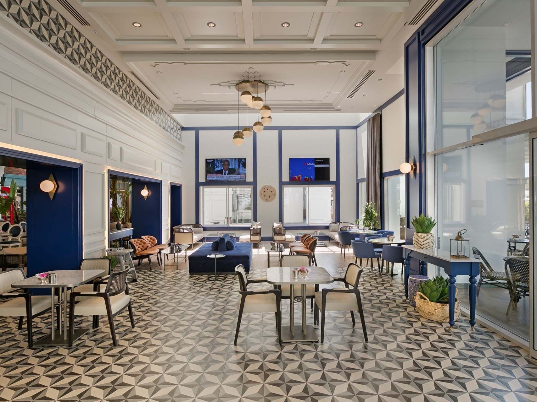 Dining area arranged with tables and chairs in Caprice Patisserie Bar at Titanic Deluxe Golf Belek