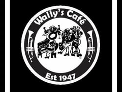 Black and white logo for Wally's Cafe, established in 1947, featuring musicians and instruments.