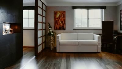 A white sofa in Premium Superior Suite at Liebes Rot Flueh