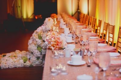 Long wedding dining table with floral setup at Matrix Hotel