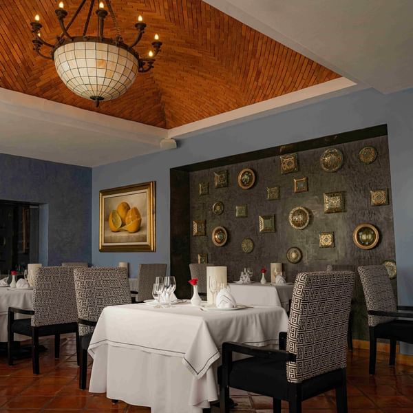 Elegant interior with decorative walls in Canto Del Mar restaurant at Marquis Los Cabos Resort