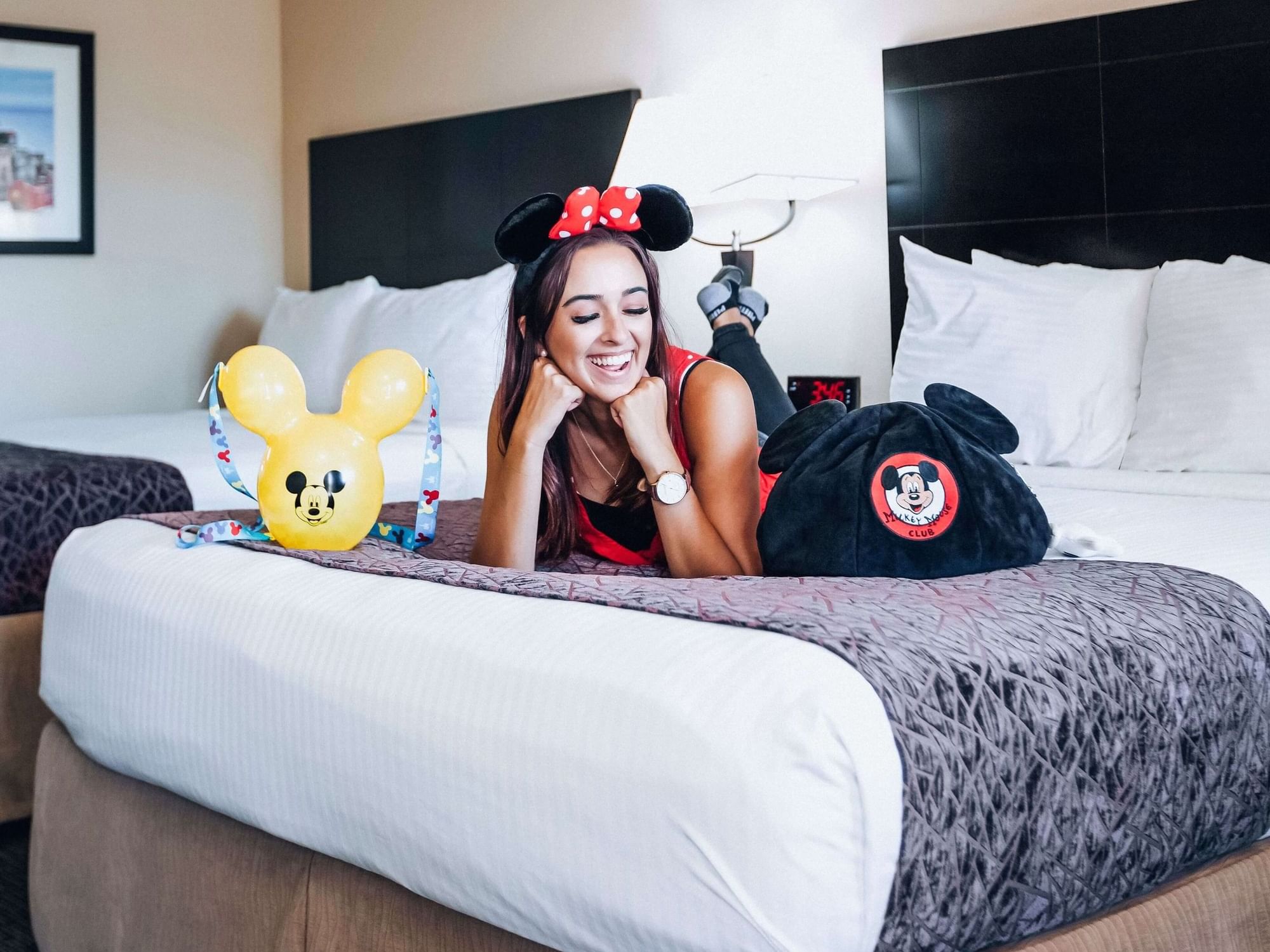 A woman with Minnie items at Grand Legacy at The Park Anaheim.