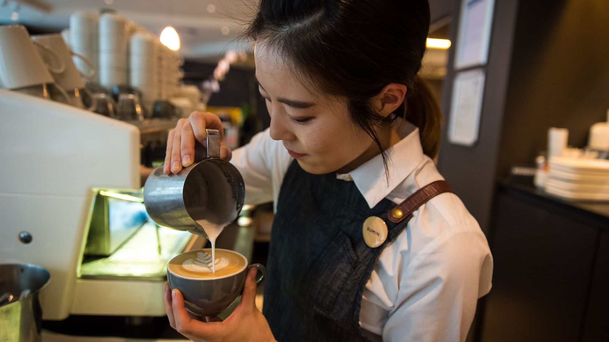 Close up on barista making coffee at Novotel Melbourne