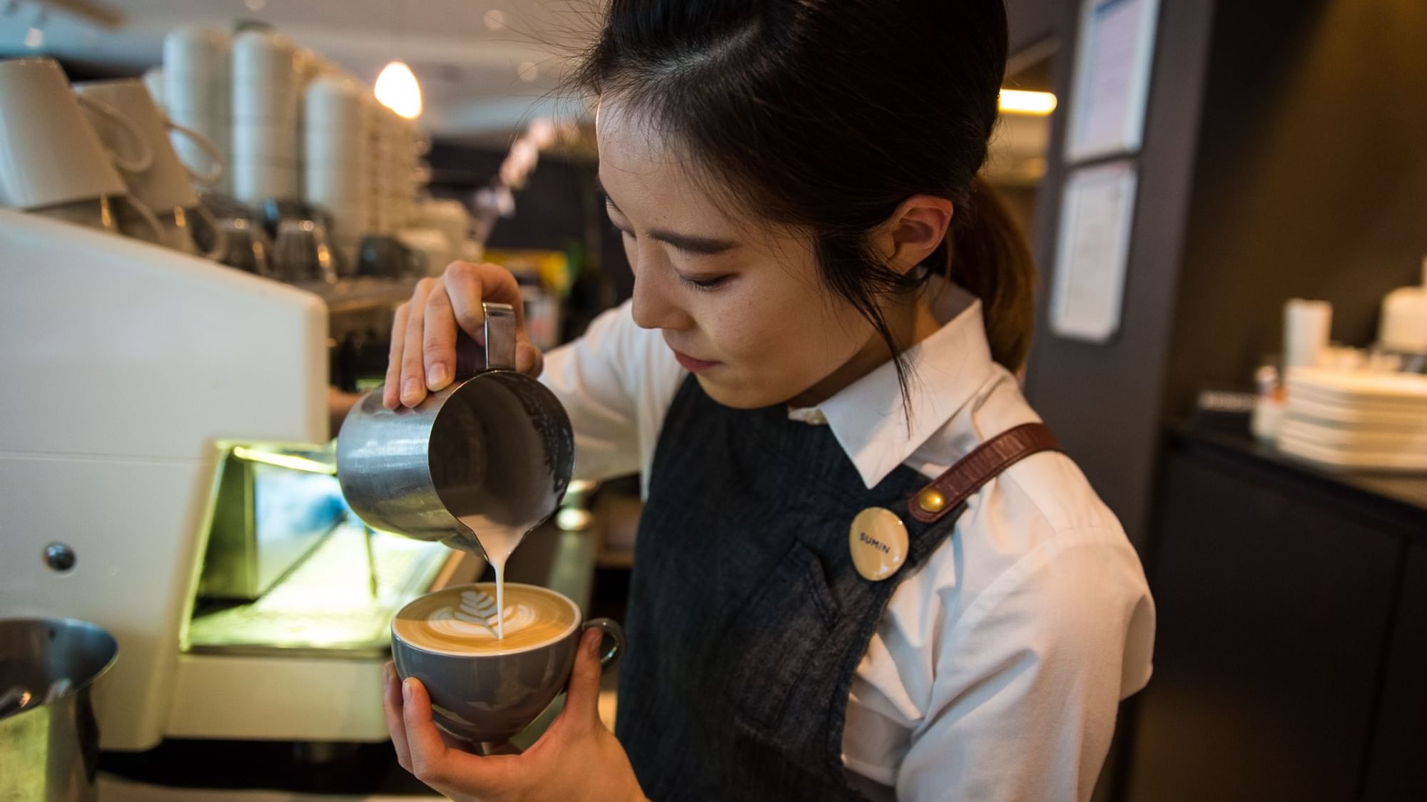 Close up on barista making coffee at Novotel Melbourne
