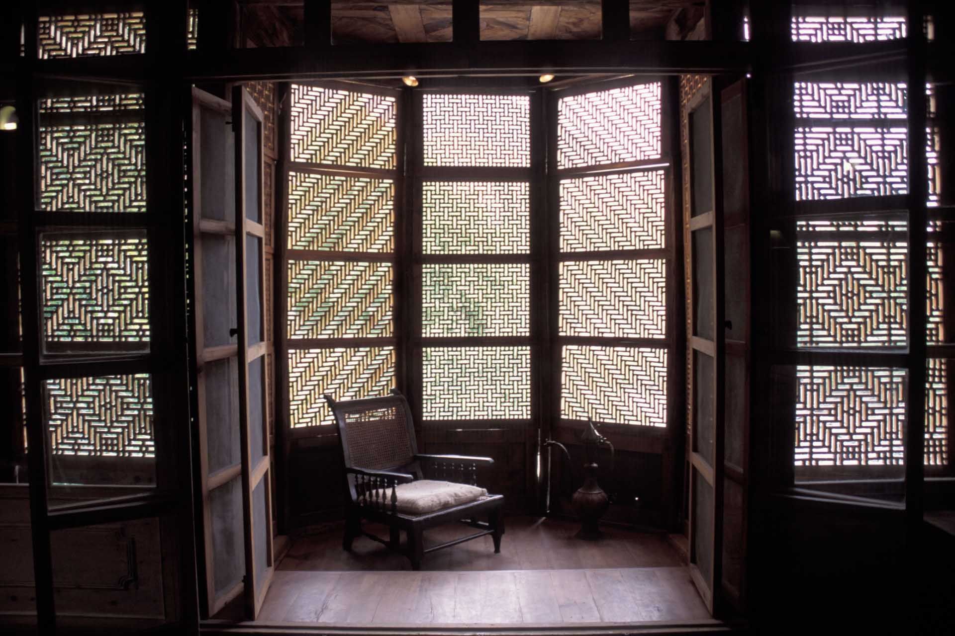 A lounging chair in a hotel room at Shigar Fort Residence