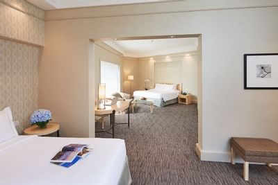 Two bedrooms in Deluxe Family with carpeted floors at York Hotel Singapore