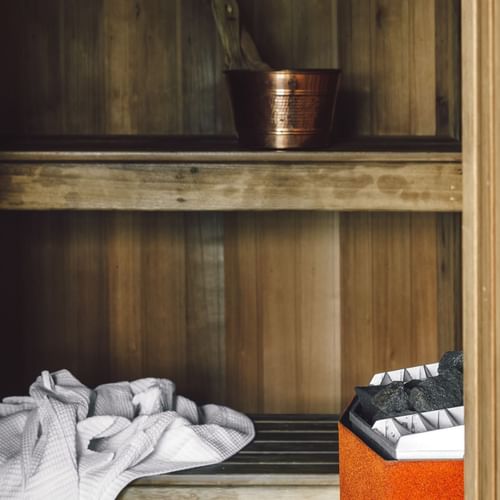 Towel & copper bucket in Pearl Penthouse Sauna, Como Melbourne